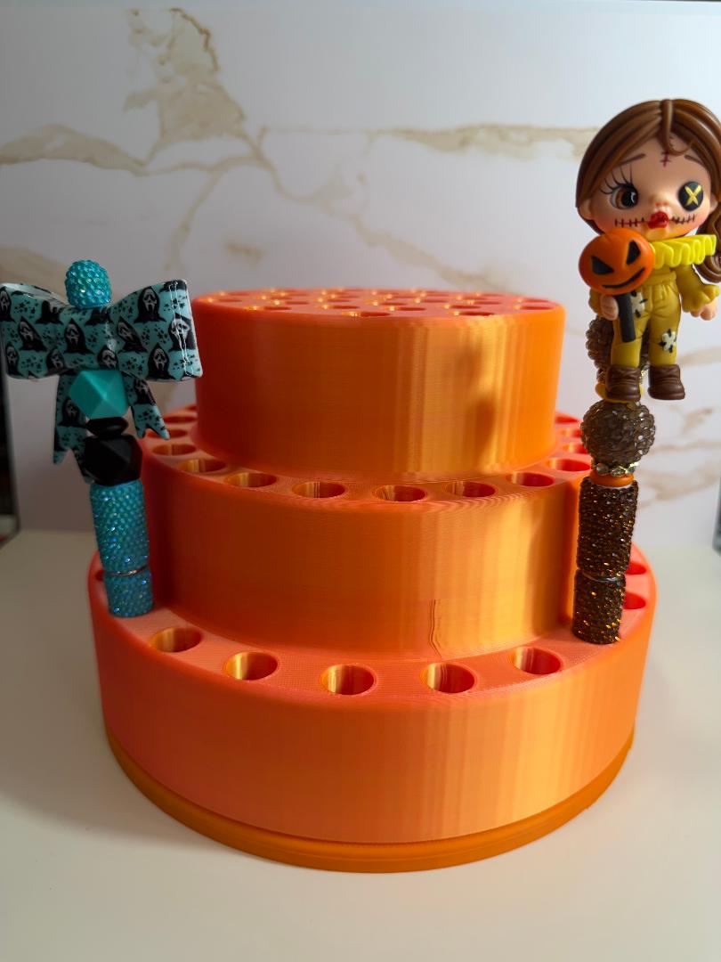 Rotating pen holder
